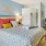 a bedroom with a bed and lamps
