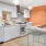 a kitchen with a table and chairs