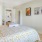 a bedroom with a bed and a shelf
