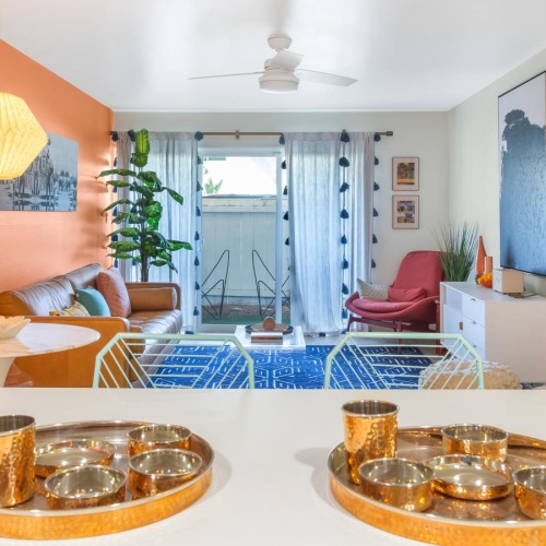 Relax and unwind in well-lit living areas a living room with a table and chairs