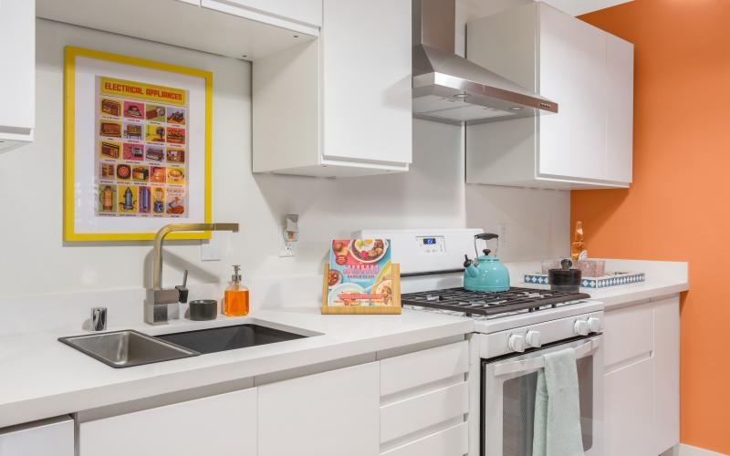 a kitchen with white cabinets