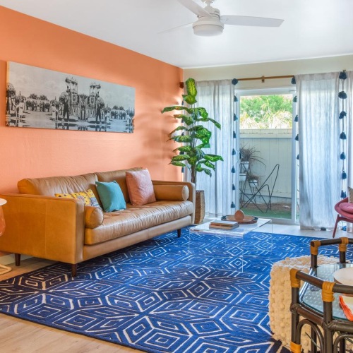 Find your perfect fit at Koda on Fremont a living room with a rug