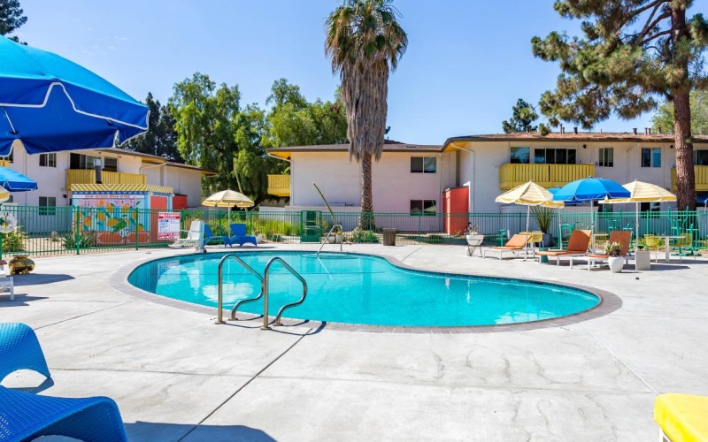 a swimming pool with umbrellas