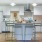 a kitchen with a bar stools